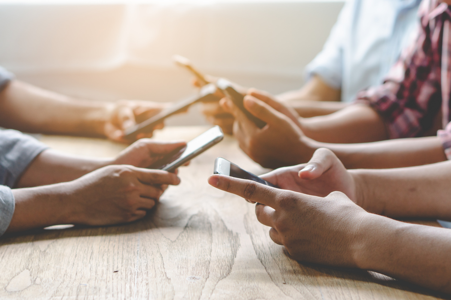 Group of friends on phones.